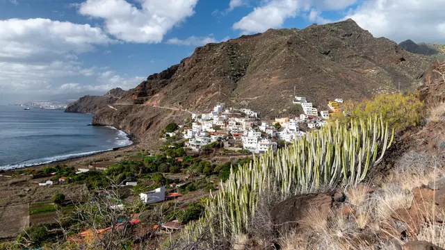 Playa de Igueste beach in Tenerife, featuring a pebbly shoreline with moderate water conditions