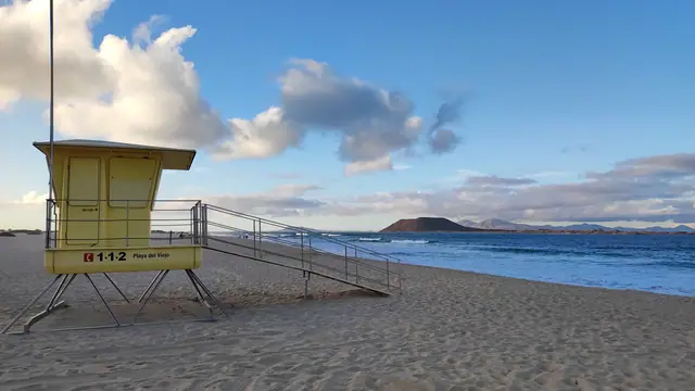 El Viejo beach in Fuerteventura, featuring a sandy shoreline with surfable water conditions