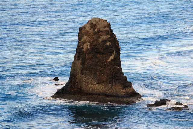 Playa de Benijo beach in Tenerife, featuring a sandy shoreline with surfable water conditions