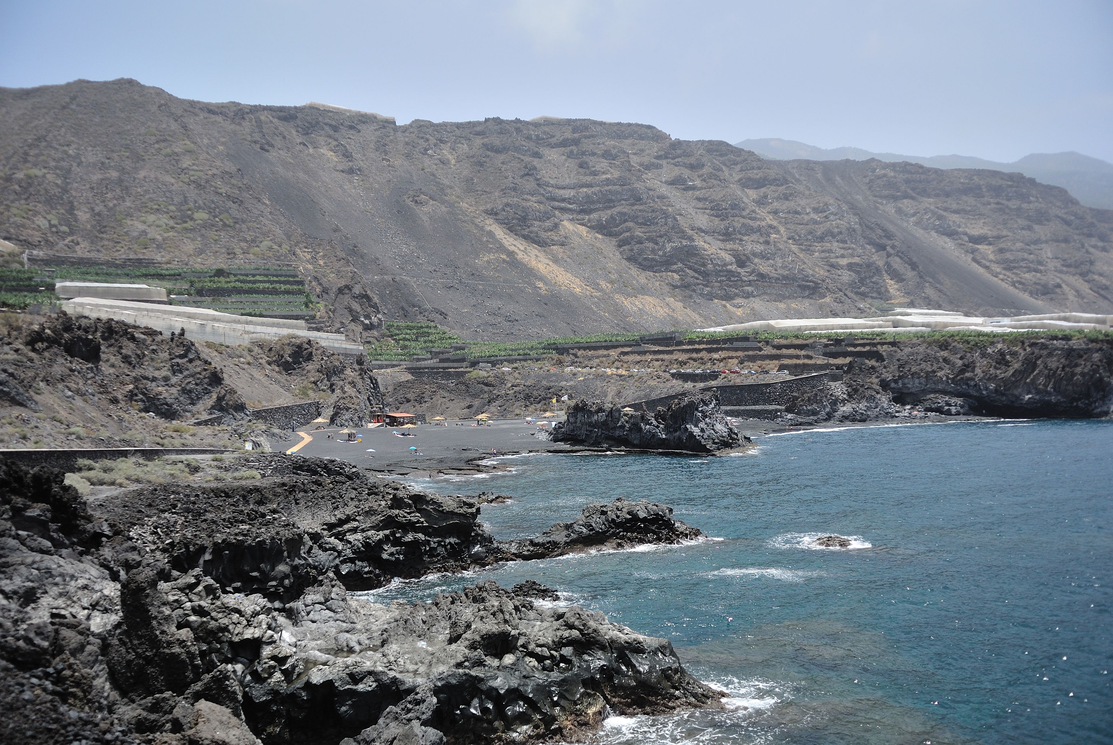 Playa de Los Monjas beach in La Palma, featuring a pebbly shoreline with moderate water conditions