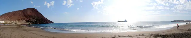 Playas de Granadilla beach in Tenerife, featuring a sandy shoreline with moderate water conditions