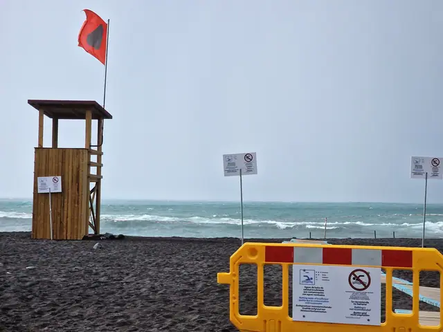 Playa Castillo beach in Tenerife, featuring a sandy shoreline with moderate water conditions