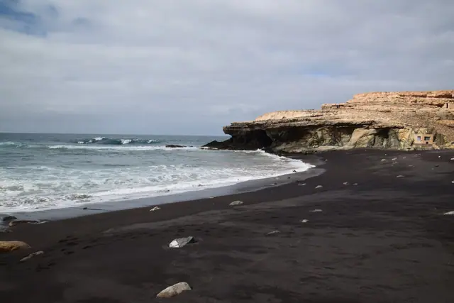 Playa de los Muertes beach in Fuerteventura with wavy water conditions