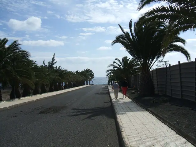 Playa El Ancia beach in Lanzarote, featuring a sandy shoreline with wavy water conditions