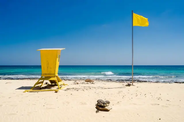 Playa del Bajo Negro beach in Fuerteventura, featuring a sandy shoreline with moderate water conditions