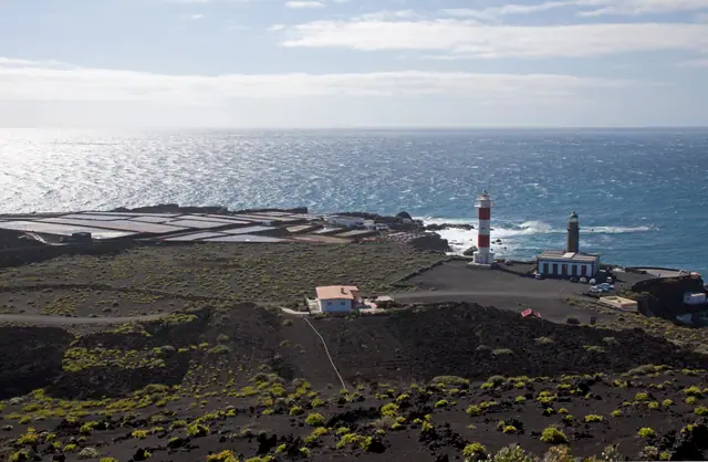 Playa de Malpique beach in La Palma, featuring a sandy shoreline with wavy water conditions