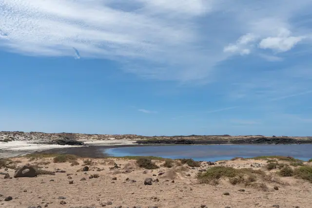 Playa de Beatriz beach in Fuerteventura, featuring a sandy shoreline with moderate water conditions