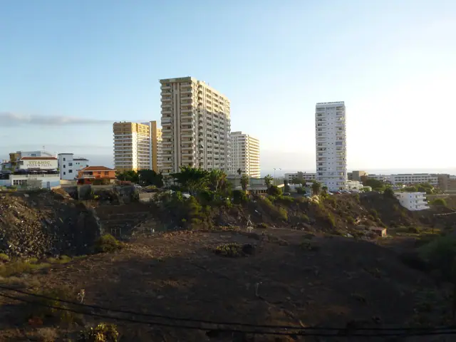 Playa Las Galgas beach in Tenerife, featuring a sandy shoreline with moderate water conditions