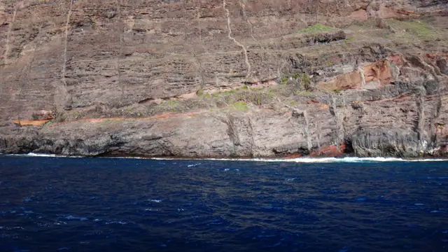 Playa de Barranco Seco beach in Tenerife, featuring a pebbly shoreline with moderate water conditions