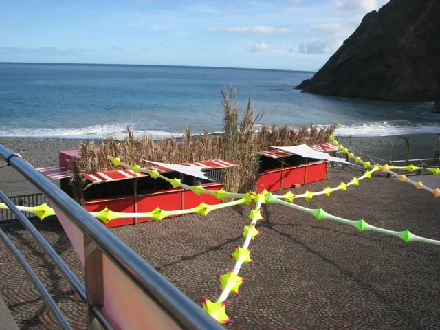 Playa de Vallehermoso beach in La Gomera, featuring a pebbly shoreline with wavy water conditions