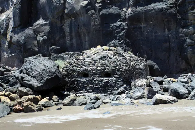 Playa de la Arena beach in Lanzarote, featuring a sandy shoreline with moderate water conditions