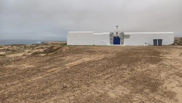 Playa del Salado beach in La Graciosa, featuring a sandy shoreline with wavy water conditions